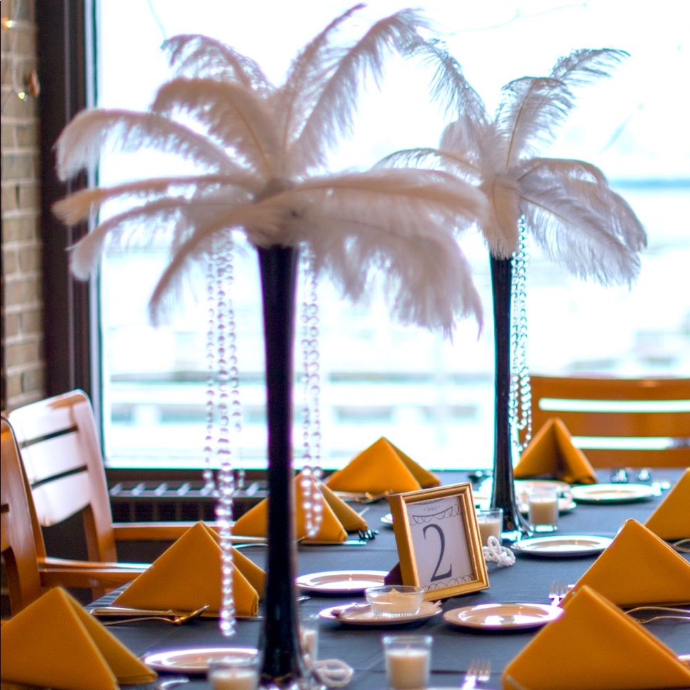 21” inch high black glass vases.  Two dozen in total, the price is for all :) .